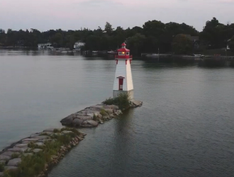 lighthouse on a piece of land in the lake