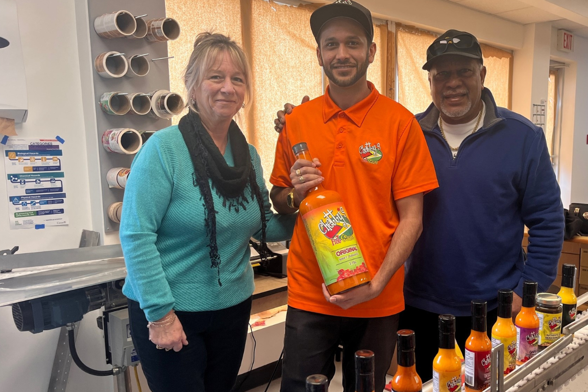 Chetty family standing together with their hot sauces