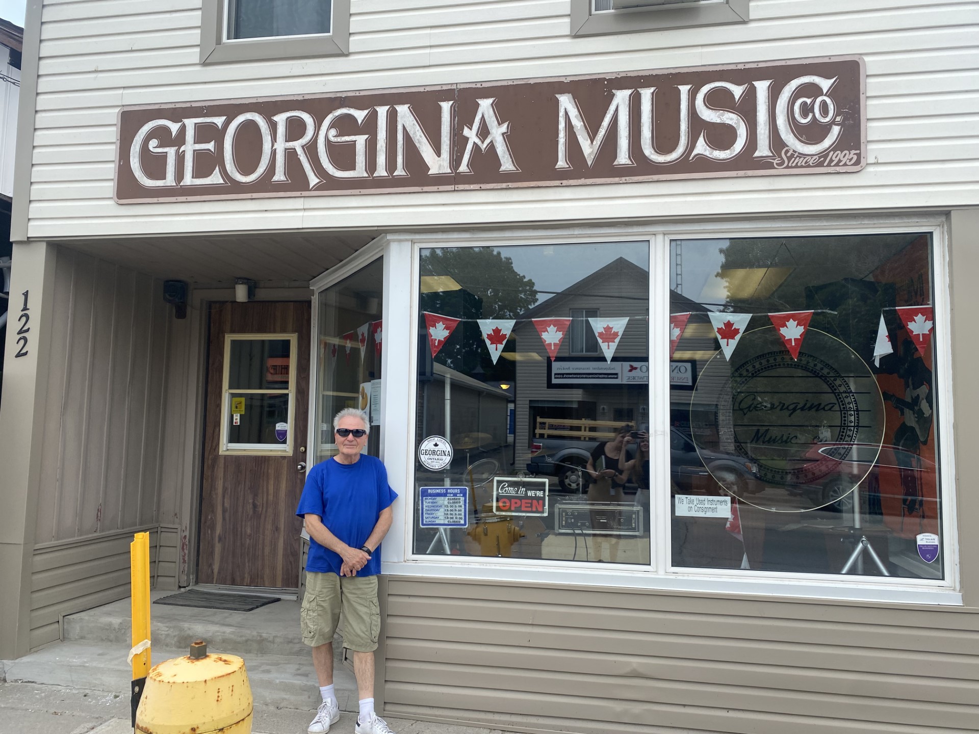 Georgina Music owner Joe in front of store on High Street in Sutton