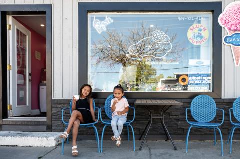 kids sitting outside of ice cream shop in Sutton